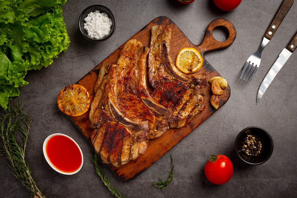 Delicious beef shank served on a rustic wooden table, garnished with fresh herbs and vegetables, showcasing the rich, tender texture of the meat.